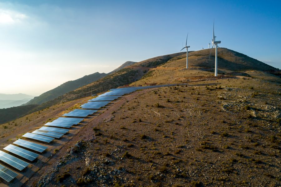 Wind turbines and solar array at the Louzes project.