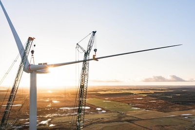 In evening light on December 23, 2022, the second of three blades is mounted on the first Vestas V236-15.0MW wind turbine at the Østerild Wind Turbine Test Center in Northern Jutland, Denmark.  The final blade was mounted later on the same day.