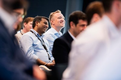 Newly graduated Vestas employees gather at Vestas headquarters in Aarhus for a panel discussion, Q&A, and to celebrate their accomplishments. 