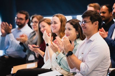 Newly graduated Vestas employees gather at Vestas headquarters in Aarhus for a panel discussion, Q&A, and to celebrate their accomplishments. 