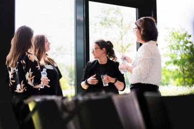 Newly graduated Vestas employees gather at Vestas headquarters in Aarhus for a panel discussion, Q&A, and to celebrate their accomplishments. 