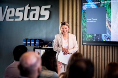 Newly graduated Vestas employees gather at Vestas headquarters in Aarhus for a panel discussion, Q&A, and to celebrate their accomplishments. 