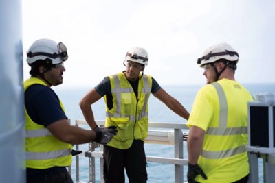 People standing outside on offshore wind farm