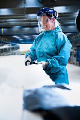 A Vestas employees inspect the construction process of a 115.5 metre long V236-15.0MW wind turbine blade at Nakskov, Denmark.