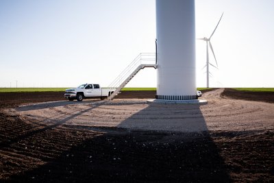 Service car next to wind turbine