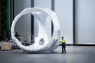 A Vestas employee inspects newly assembled components for the V236-15.0MW wind turbine at the nacelle factory in Lindø, Denmark.
