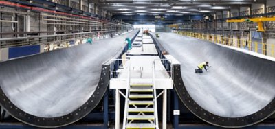 Vestas Wind Systems employees perform final checks on their new 15 megawatt V236 wind turbine blade mould at their factory in Nakskov, Denmark.